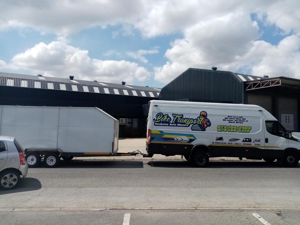 Motorcycle on carrier truck for secure nationwide shipping